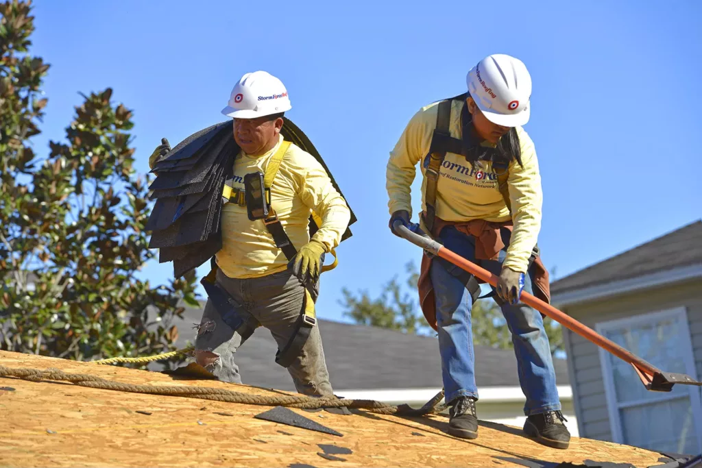 Two StormForce crew members working on a roofing project in Jacksonville.