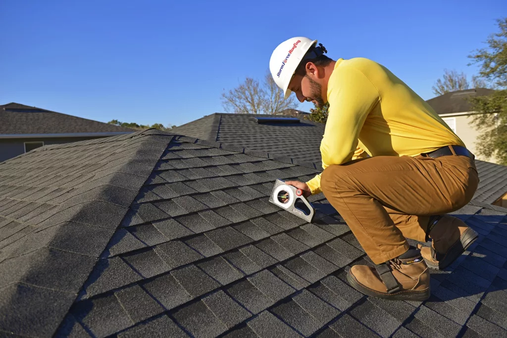StormForce Roofing crew member working on the roof of a project in St. Augustine, Florida.