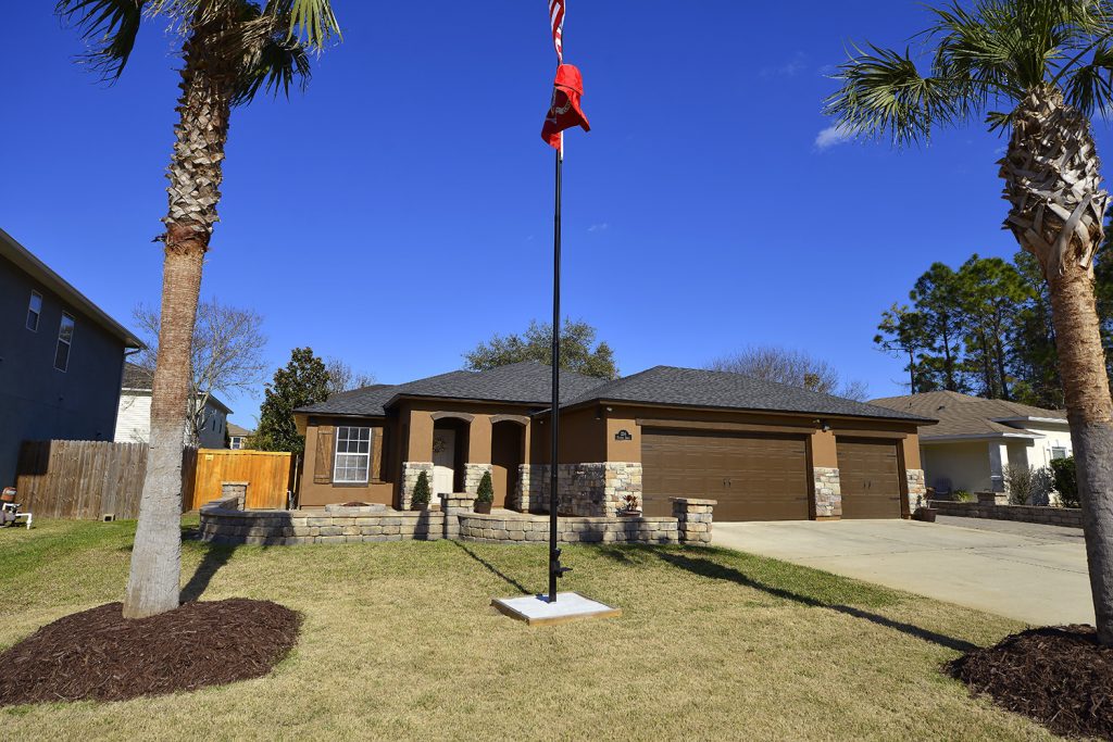 A home in Palm Coast, FL with a new asphalt shingle roof installed by StormForce Roofing.