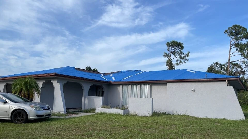 Roof tarping after storm